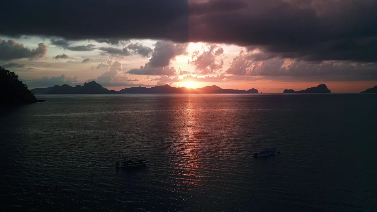 A sunset over the sea: the left of the picture is the shot as it was filmed, the right the same shot with Go Glow